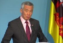 李顯龍回應近期政壇風波:絕不姑息貪污行為 個人行為不當就會盡量以人性化的方式處理 李顯龍提醒民眾,即使已經接種,也應遵守保持社交距離等防疫規定。(路透社資料圖片)